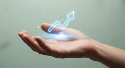 Businessman holding a holographic digital arrow graph in hand, illustrating a concept of business growth, financial success, and technological innovation