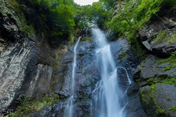 Beautiful mountain waterfall view from the bottom in Georgia