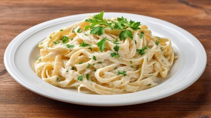 Creamy Fettuccine Pasta Dish with Fresh Parsley Garnish on Wooden Table Surface for Delicious Italian Cuisine Presentation