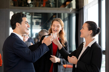 Group team business people meeting and celebrating for success and cheering with drink in office, collaboration and event of teamwork in modern office, communication and networking with marketing.