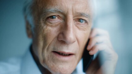 Elderly man connects via phone, sharing emotions and experiences during a meaningful conversation at home