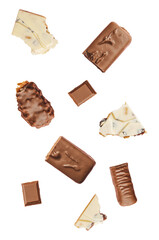 assortment of various chocolate bar pieces scattered dynamically