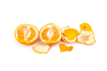 Orange with peel and seeds separated on white background - top view