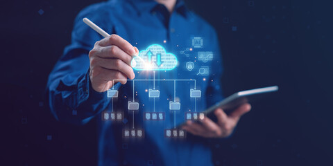 Businessman using digital pen and tablet with cloud computing and data storage network system. Concept of online file sharing, big data management, and secure cloud technology.