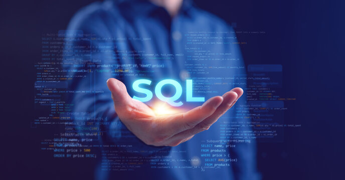 Developer hand holding glowing SQL text with digital database code, concept of programmer training, software development, SQL tutorial, education, and data management for IT solutions and learning.
