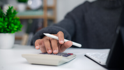 Business Accounting and Financial Calculation with Calculator and Pen
