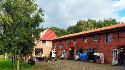 The typical red brick and wood architecture in the tourist area of ​​Cape Arkona, on the island of R&uuml;gen, Germany. The old farmhouses have now been converted into shops and restaurants.