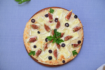 original gourmet pizza with figs and brie cheese, flat lay 