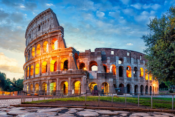 Colosseum morning in Rome, Italy. Colosseum is one of the main attractions of Rome. Illumination of the Colosseum. Rome architecture and landmark.