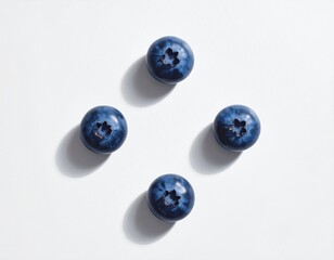 Four blueberries on a white background 