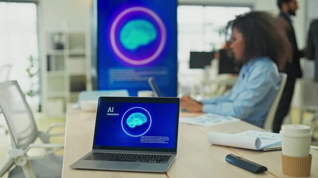 Business professional concentrates in coworking space leveraging AI powered virtual assistant and realtime big data analytics on laptop display for hyper automated workflow intelligence optimization