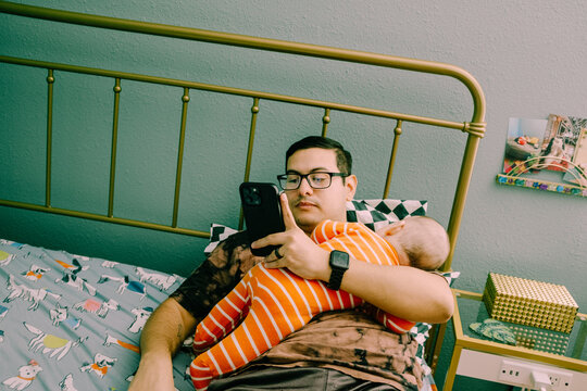 baby sleeping on dad