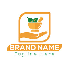 Orange hand holding mortar pestle with green leaves for ayurvedic logo ayurveda brand