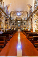 Baroque church interior with decorated nave and altar in Ascoli Piceno