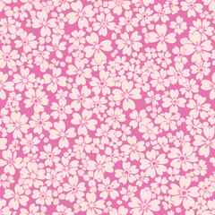 A delicate pink floral pattern featuring numerous small blossoms covering the entire frame.