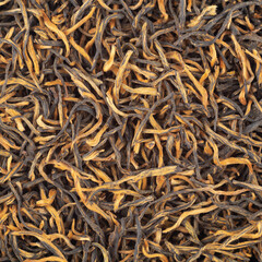 Jin Jun Mei Golden Eyebrows golden leaves hand-picked buds famous Chinese red tea. Closeup macro pattern background