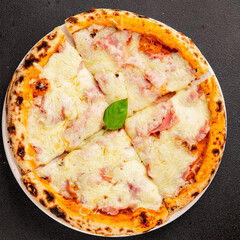 Pizza ham, cheese, tomato sauce fast food natural product tasty snack fresh delicious gourmet food background on the table rustic top view copy space