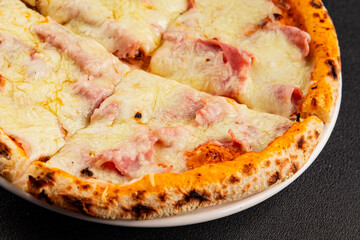 Pizza ham, cheese, tomato sauce fast food natural product tasty snack fresh delicious gourmet food background on the table rustic top view copy space