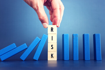 stopping the domino effect. executive and risk control concept