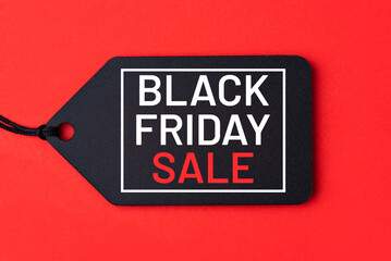 Black Friday Sale tag on red background