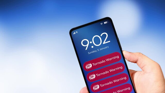 Tornado Warning notification appearing on the smartphone screen close up, 4k footage.