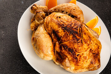 Baked chicken with oranges whole grilled chicken christmas holiday dish new year natural product tasty snack fresh delicious gourmet food background on the table rustic top view copy space