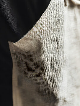 Beige chemical resistant apron side pocket in close up