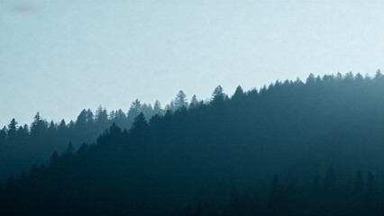 Silhouetted forested hillside under a hazy sky