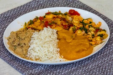 Moqueca capixaba is a typical dish from Espírito Santo, Brazil, made with ocean fish and shrimp. It's cooked gently and flavorfully in a clay pot without the use of palm oil or coconut milk.