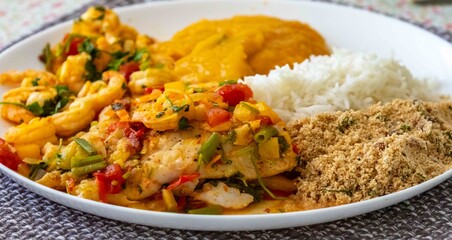 Moqueca capixaba is a typical dish from Espírito Santo, Brazil, made with ocean fish and shrimp. It's cooked gently and flavorfully in a clay pot without the use of palm oil or coconut milk.