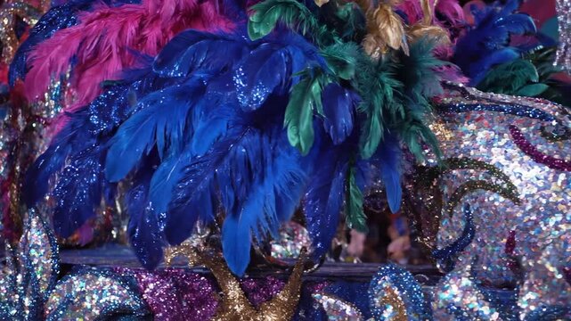 Abstract, vibrant float decoration adorned with shimmering feathers and sequins slowly glides past colorful, Abstract, fantasy