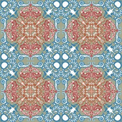 Seamless ornamental pattern with intricate floral mandala shapes in red and blue tones on beige background. Elegant ethnic design for fabric, wallpaper, wrapping paper, and decorative projects.