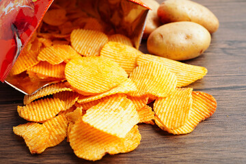 Potato chips , delicious BBQ seasoning spicy for crips, thin slice deep fried snack fast food.