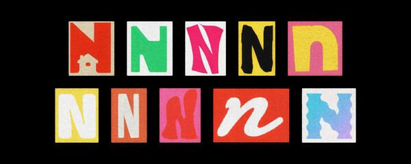 Assorted letter N typography styles, paper cutouts on black background
