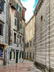Take a stroll down an enchanting narrow street adorned with ageold stone buildings in a delightful European city