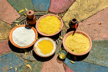 Food on a clay plate being offered to Exu in an Umbanda and Candomble ceremony.