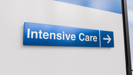 A Blue Intensive Care Sign With an Arrow in a Hospital Corridor