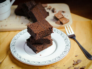 Several slices of chocolate cake with chocolate