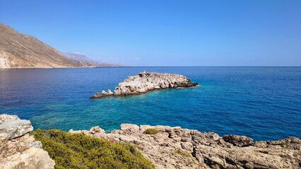 Rocks off the coast of the picturesque village of Loutro in Crete