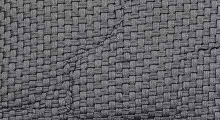 Naklejka premium Close Up Shot of Dark Gray Woven Material Texture Showing Intricate Patterns and Fibers