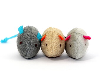 Three very cute soft mice toys for a cat isolated on white background.
