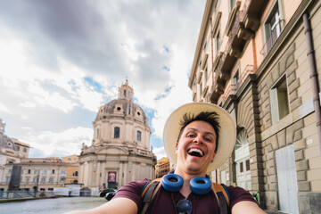Happy smiling tourist enjoying vacation, exploring city while taking self portrait- Chiesa di Santa...