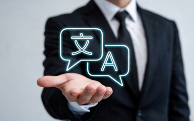 Businessman Holding a Holographic Language Translation Icon for Global Business Communication