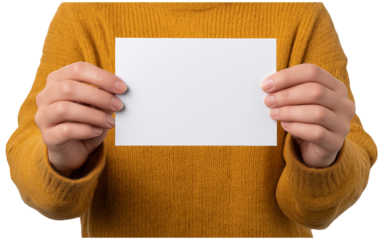 Person holding blank white card in yellow sweater hands isolated on a transparent background
