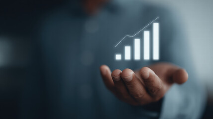 Businessperson hand holding glowing bar chart, growth, success, futuristic, technology concept