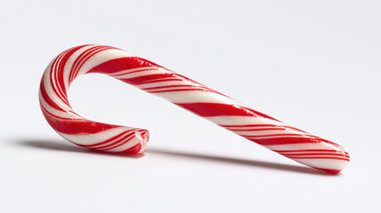 Obraz premium Candy cane with red and white stripes isolated on white background, symbol of christmas and holiday sweetness