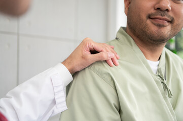 The doctor talks and encourages the patient about treatment options using a digital tablet, promoting clear communication and trust in a bright and supportive hospital environment.