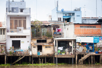 JAN 28 2014 - MY THO, VIETNAM - Houses by a river, on JAN  28, 2014, in  Mekong Delta, Vietnam