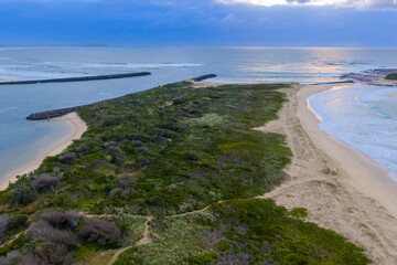 Drone aerial photograph of the South Pacific Ocean and beach at Kurrakwah Bay near the coastal town of Warilla in the Illawarra region on the south coast of NSW, Australia.