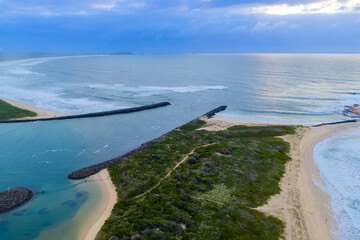 Drone aerial photograph of the South Pacific Ocean and beach at Kurrakwah Bay near the coastal town of Warilla in the Illawarra region on the south coast of NSW, Australia.